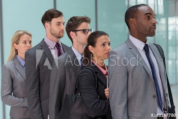 Business people waiting in queue