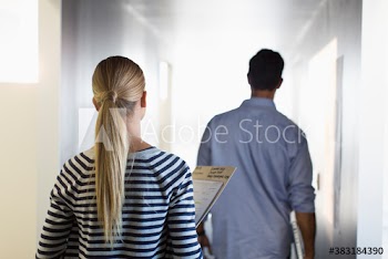 Business people walking in office corridor