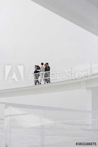 Business people walking on modern balcony