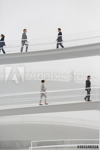 Business people walking on modern ramps