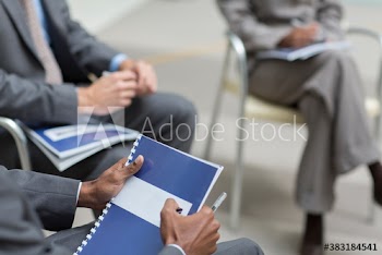 Business people with paperwork in meeting