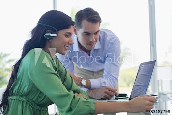 Business people working at laptop