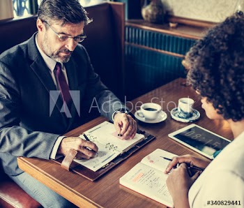 Business people working in a cafe