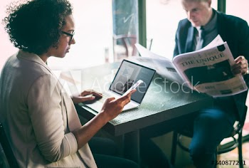 Business people working in a cafe