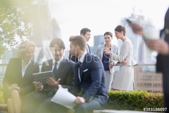 Business people working in city park