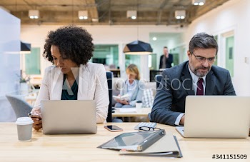 Business people working on digital devices