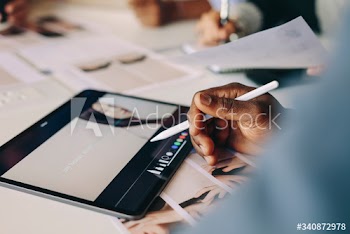Business people working on digital tablet for a project