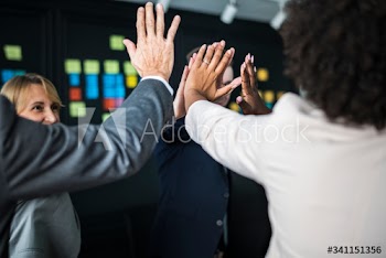 Business team giving a high five