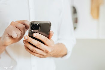 Businessman checking his social media account and messages on a phone | Free  photo - 2353126