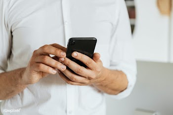 Businessman checking his social media account and messages on a phone | Free  photo - 2353142