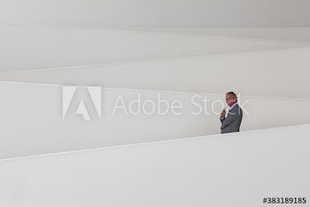 Businessman on modern office ramp