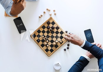 Businessman planning a chess game