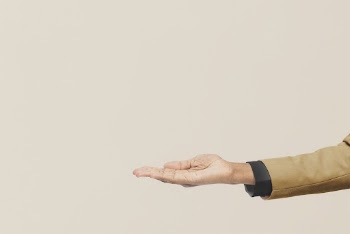 Businessman reaching out, beige background | Free Photo - rawpixel