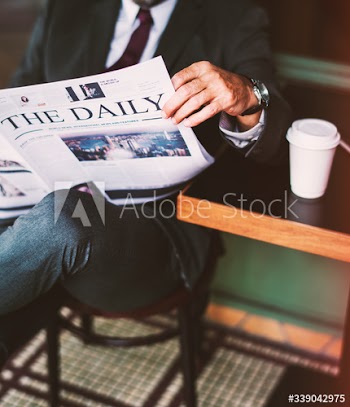 Businessman reading the daily news