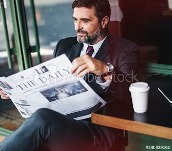 Businessman reading the daily news