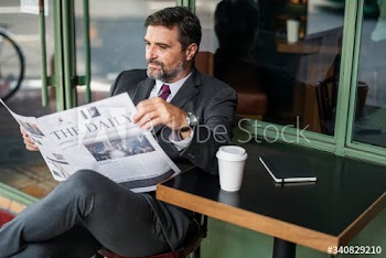 Businessman reading the daily news