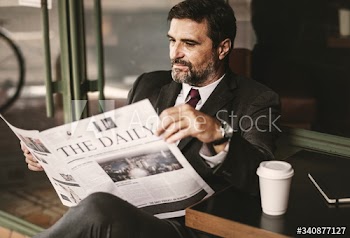 Businessman reading the daily news