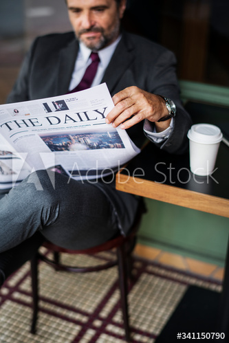 Businessman reading the daily news