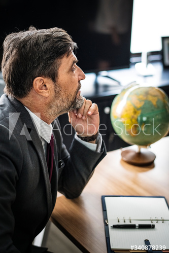 Businessman sitting alone by a table