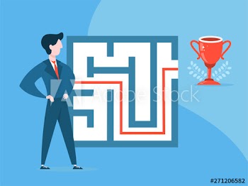 Businessman standing at the labyrinth or maze