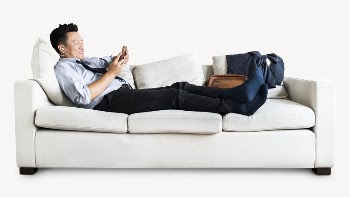 Businessman texting on sofa isolated | Free PSD - rawpixel