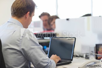 Businessman using laptop in office