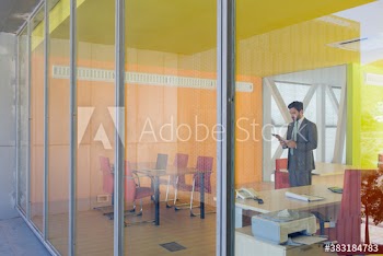 Businessman with digital tablet working in modern office