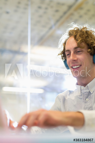 Businessman with headphones working
