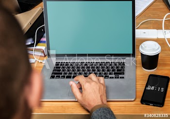 Businessman working on a laptop a during meeting