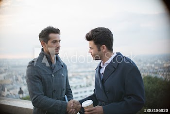 Businessmen shaking hands, Montmartre, Paris, France