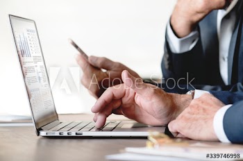 Businessmen using computer laptop