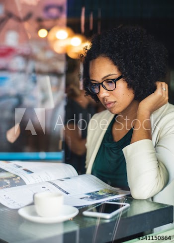 Businesswoman reading the daily news