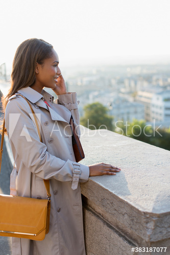 Businesswoman talking on smart phone, Montmartre, Paris, France