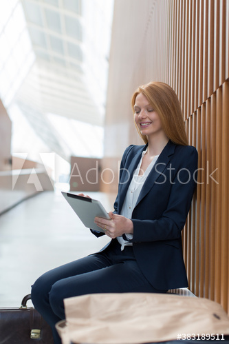 Businesswoman with digital tablet in modern office