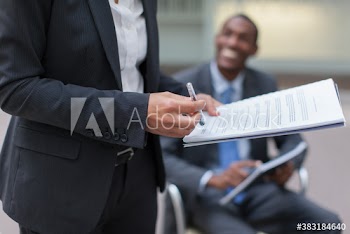 Businesswoman with paperwork in meeting