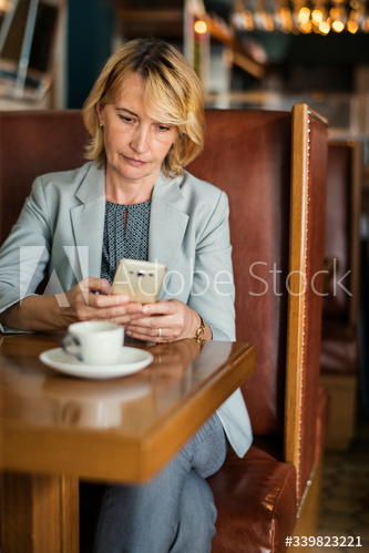 Businesswoman working remotely from a cafe