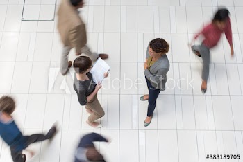 Businesswomen talking in corridor