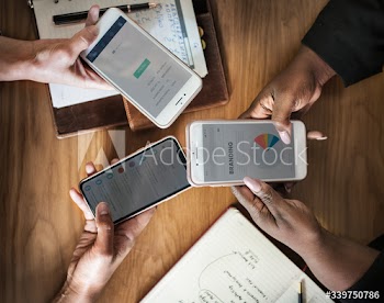 Businesswomen using phones for work