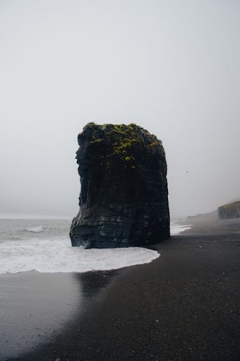butte near body of water