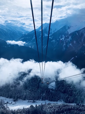 Cable Car Under White Clouds