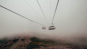 Cable Cars Across Foggy Mountain