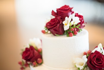 Cake Topped With Red Rose-themed Icing