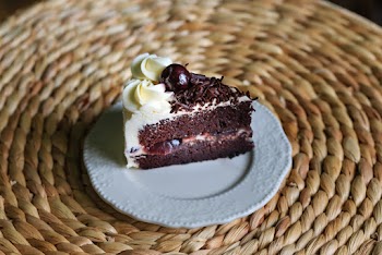 Cake With White Icing On White Saucer