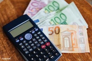 Calculator and Euro banknotes on a table | Free  photo - 2353115