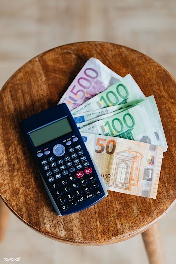 Calculator and Euro banknotes on a table | Free  photo - 2353121