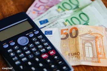 Calculator and Euro banknotes on a table | Free  photo - 2353125
