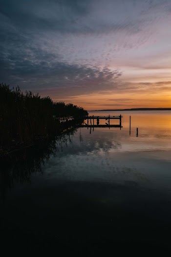 Calm Body of Lake during Golden Hour
