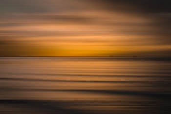 calm body of water during golden hour