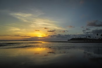 Calm Body Of Water During Golden Hour
