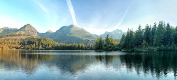 Calm Body Of Water Near Mountain